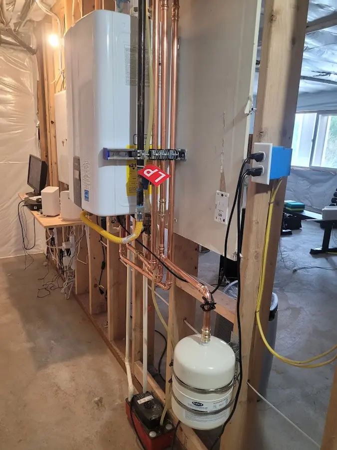 Licensed plumber repairing a kitchen sink in Oronogo